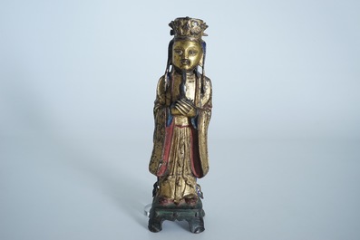 Een Chinese deels vergulde en polychrome bronzen figuur van Wenchang Dijun, Ming