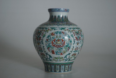 A Chinese famille rose vase with ladies in a garden, 19/20th C.