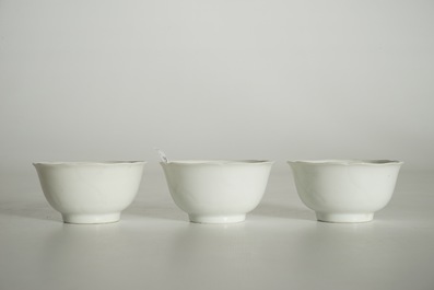 Three blanc de Chine cups and saucers with floral anhua design, Yongzheng/Qianlong