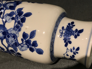 A Chinese blue and white rouleau vase with floral design, Kangxi