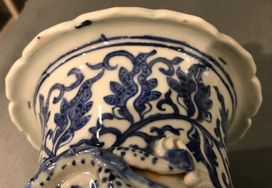 A Chinese blue and white lotus scroll vase, 19th C.