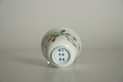 A Chinese famille verte cup with goji branches, Kangxi mark, 19/20th C.