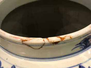 A tall Chinese blue and white baluster jar and cover with a phoenix, 19th C.