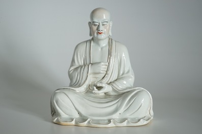 A large Chinese porcelain model of a seated Luohan, 20th C.