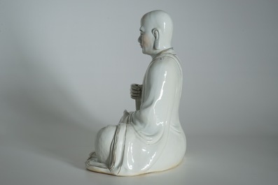 A large Chinese porcelain model of a seated Luohan, 20th C.