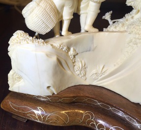 Two Chinese carved ivory groups on wooden base, 2nd quarter 20th C.