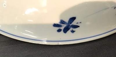 A Chinese blue and white dish with sanduo fruits among foliage, Kangxi