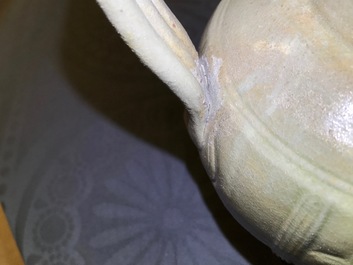 A Chinese greenware ewer with incised peony design, Song