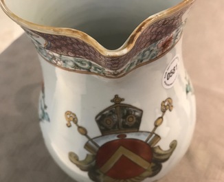 A large Chinese famille rose armorial jug with floral design, Yongzheng