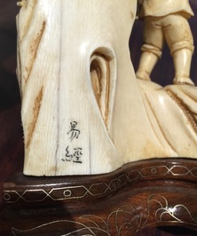 Two Chinese carved ivory groups on wooden base, 2nd quarter 20th C.