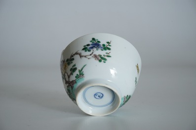 A Chinese famille verte cup and saucer with yin-yang mark, Kangxi