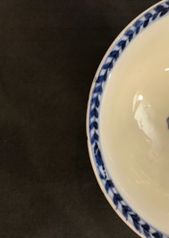 Une tasse et soucoupe en porcelaine de Chine bleu et blanc figurant La Vi&egrave;rge &agrave; l'Enfant, Kangxi