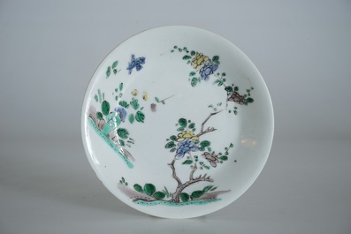 A Chinese famille verte cup and saucer with yin-yang mark, Kangxi