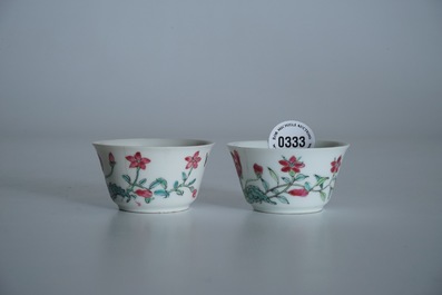 Two Chinese famille rose cups and three saucers with floral design, Yongzheng/Qianlong
