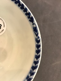 Une tasse et soucoupe en porcelaine de Chine bleu et blanc figurant La Vi&egrave;rge &agrave; l'Enfant, Kangxi