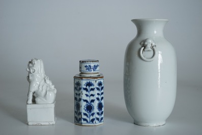 A Chinese Dehua blanc de Chine temple lion, a vase and a blue and white tea caddy, Kangxi and later