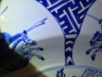 A Chinese blue and white charger with fighting warriors on horseback, Chenghua mark, Kangxi