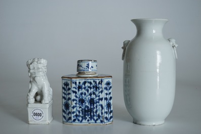 A Chinese Dehua blanc de Chine temple lion, a vase and a blue and white tea caddy, Kangxi and later