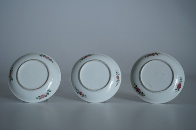 Two Chinese famille rose cups and three saucers with floral design, Yongzheng/Qianlong