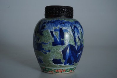 A Chinese famille verte jar with wooden cover and stand, Kangxi