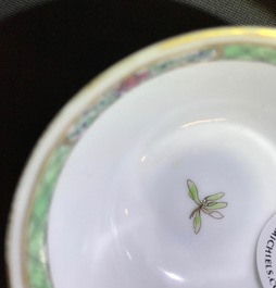 A Chinese famille rose cup and saucer with an insect on sanduo fruit, Yongzheng