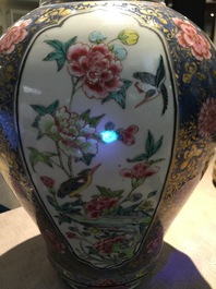 A Chinese bronze-mounted famille rose on blue-ground baluster vase and cover, Yongzheng