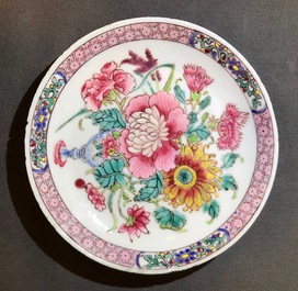 A fine Chinese famille rose cup and saucer with a flowervase, Yongzheng