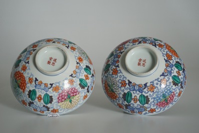 A pair of Chinese doucai bowls with floral famille rose medallions, 4-character mark, 19/20th C.