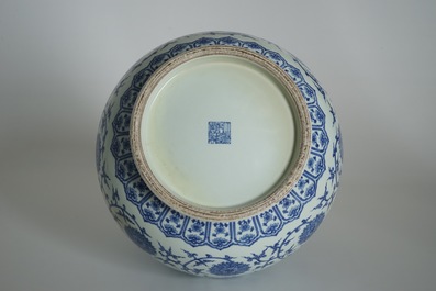 A Chinese blue and white lotus scroll hu vase, Qianlong mark, 20th C.