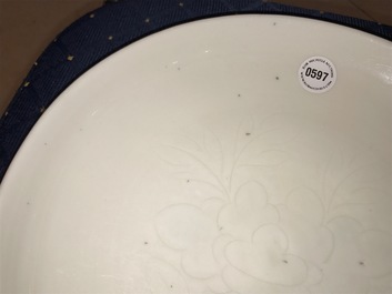 A Chinese Dehua blanc de Chine dish with incised floral design, Kangxi