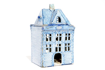 A Dutch Delft blue and white model of a house, 18th C.