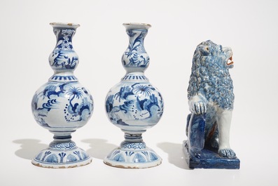 A pair of Delft style blue and white chinoiserie vases and a model of a lion with a shield, France, 19th C.