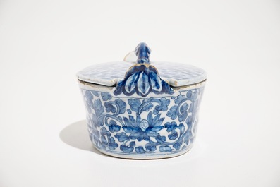 A Dutch Delft blue and white butter tub with chinoiserie design of peony scrolls, 18th C.