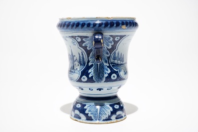 A Dutch Delft blue and white flower urn, 18th C.