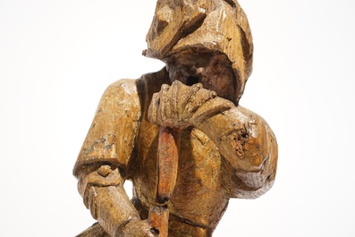 A seated soldier, retable fragment, oak with polychromy, Flanders, 16th C.
