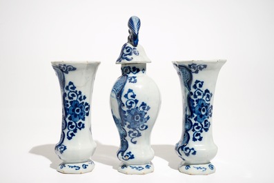 A Dutch Delft blue and white three-piece garniture with a naval scene, 18th C.