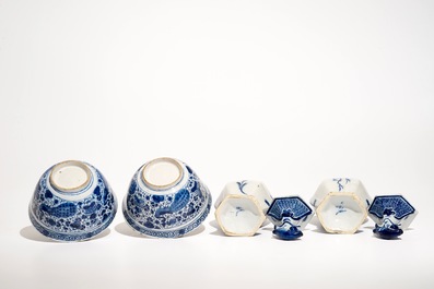 A pair of Dutch Delft blue and white bowls and a pair of vases and covers, 18th C.