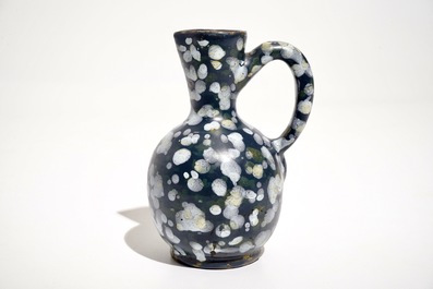 A French faience jug with blue ground &quot;A la bougie&quot; design, Nevers, 17th C.