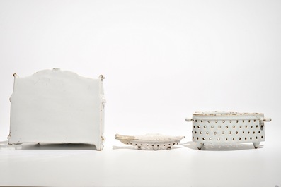 A white Dutch Delft letter holder and two strainers, 18th C.