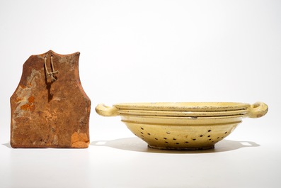 A French stoneware strainer and a wall hanger for cutlery, Aiglefontaine, 18th C.