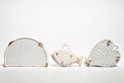 A white Dutch Delft letter holder and two strainers, 18th C.