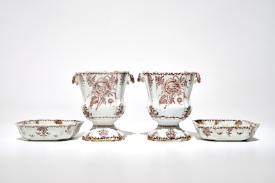 A pair of Dutch Delft manganese jardinieres on stands with floral designs, 18th C.