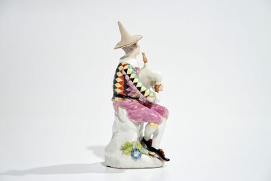 A Meissen porcelain Commedia del'Arte figure of Harlequin playing the bagpipe, 18th C.