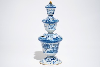 A large Dutch Delft blue and white money bank with polychrome finial, 1st half 18th C.