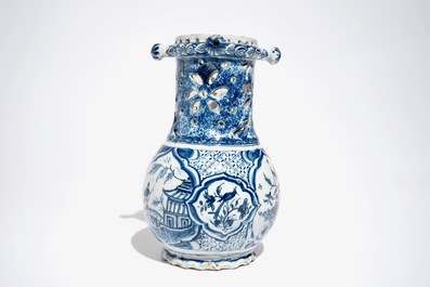 A Dutch blue and white chinoiserie puzzle jug, Delft or Rotterdam, dated 1734