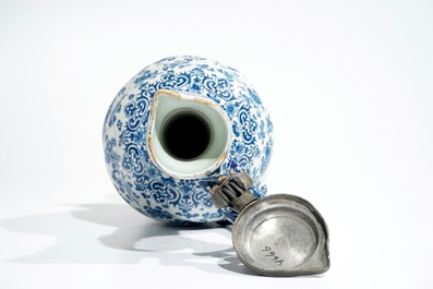 An attractive Dutch Delft blue and white gadrooned pewter-mounted jug, 2nd half 17th C.