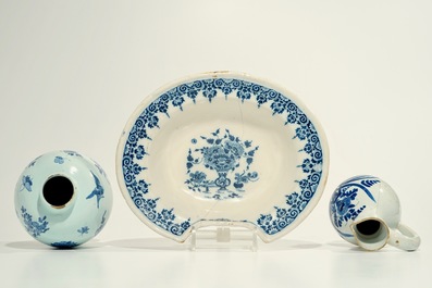 A blue and white French faience shaving bowl, a chinoiserie vase and a jug, Nevers and Moustiers, 17/18th C.