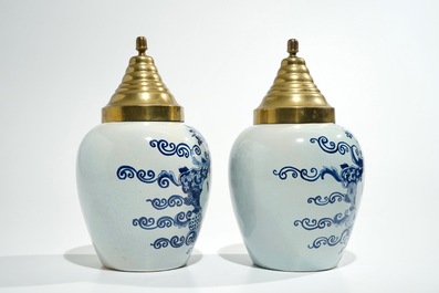 A pair of Dutch Delft blue and white tobacco jars, 19th C.
