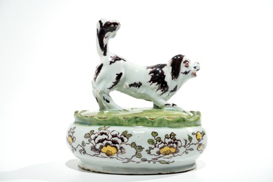 A polychrome Dutch Delft butter tub with a dog, 18th C.