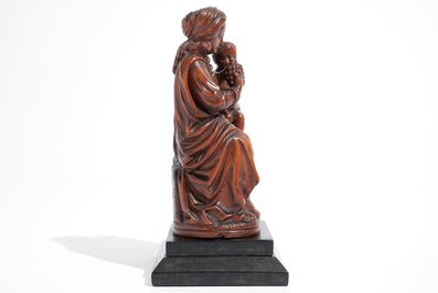 A carved boxwood Madonna with child, 17th C.